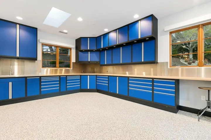Has heated floors, Central Air, Compressor w/5 car gar/ RV storage, Lift and Car washing station.