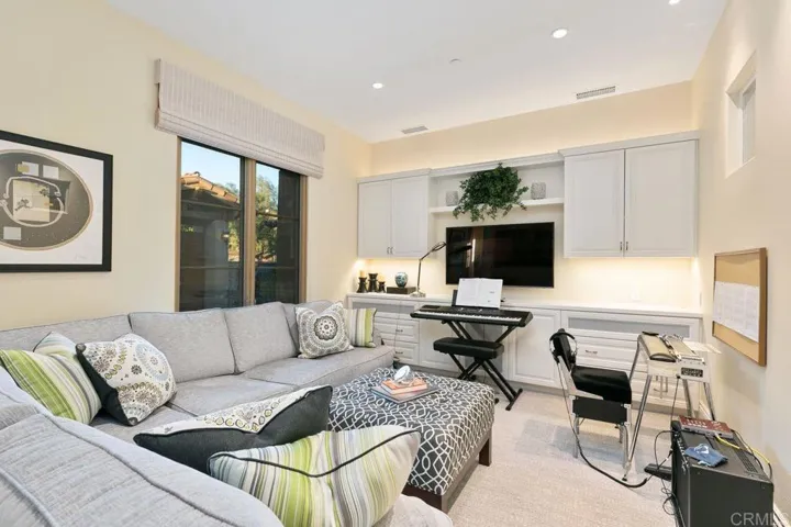 This Cozy familyroom is adjacent to the Master Bedroom Suite to relax or take a short snooze.