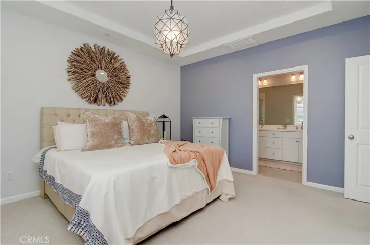 Master retreat with walk in closet and well appointed bathroom.