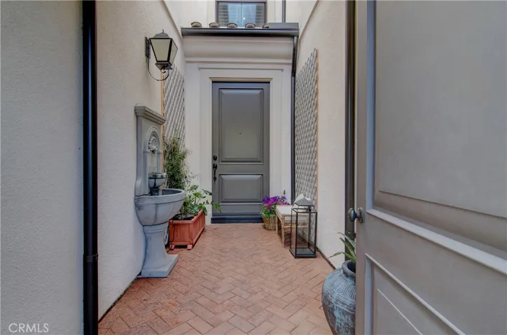 Private entrance with water feature and an added water spigot for convenience.