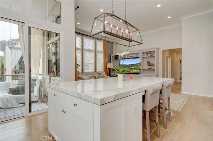 Custom oversized island right next to the patio with views.  Time to entertain.