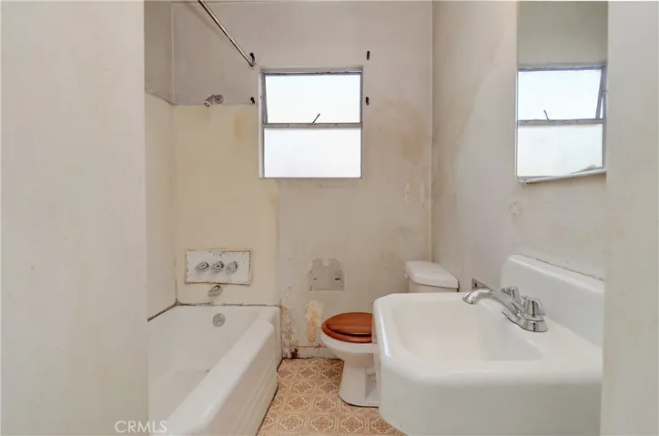 This bath has good bones, they are jsut broken and in need of a good doctor [new owner] to bring them back to full strength!