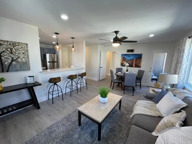 Excellent natural light and airy living and dining area with access to balcony