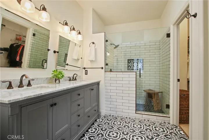 Stunning master bathroom has been completely remodeled with designer materials and a timeless style!