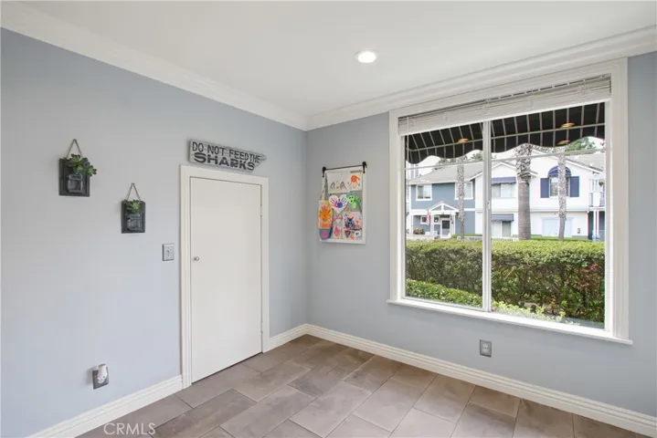 This photos shows the door to the extra deep semi walk-in kitchen storage pantry.