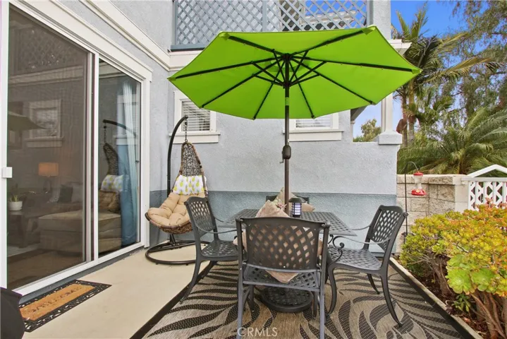 A wonderful space in the rear patio to relax and enjoy an outdoor meal.