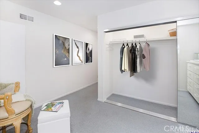 Master Bedroom Lounge and Hallway (some decorative items have been digitally staged)
