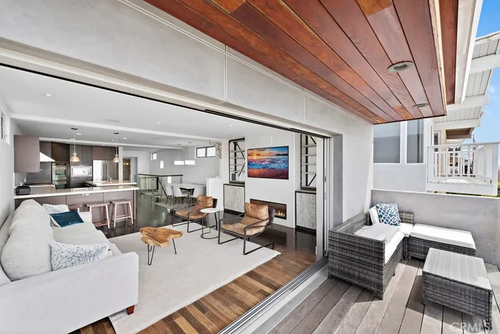 This is the view from the deck, looking into the living room.  Note the custom Fleetwood telescoping doors that remove the boundary between indoor and outdoor living.  All this and stunning ocean views as well!