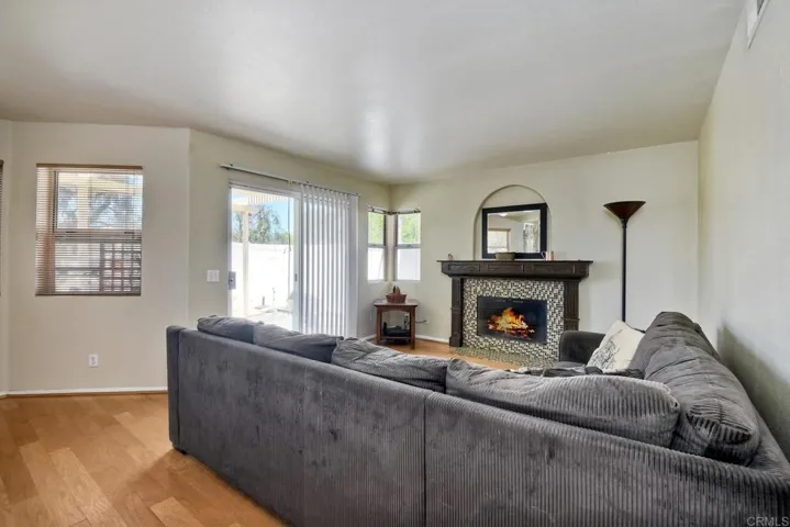 With fireplace & slider to backyard