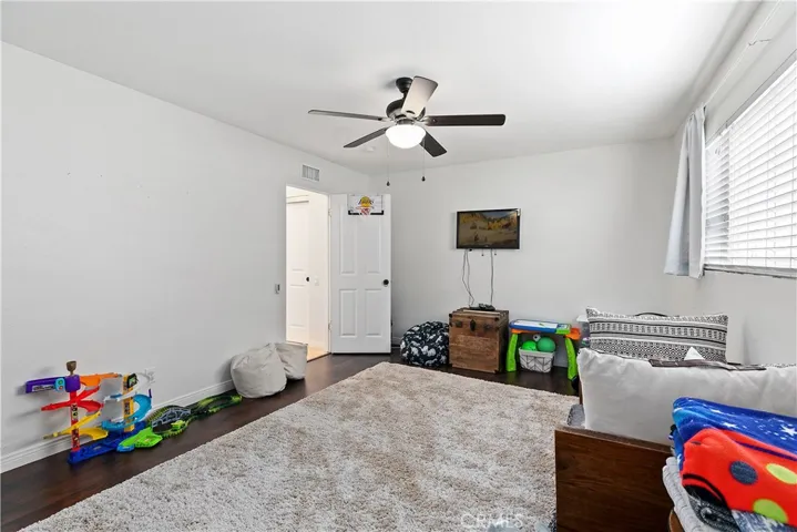 Another view of how large this room is, new ceiling fan.  Door leads to a 3/4 bath