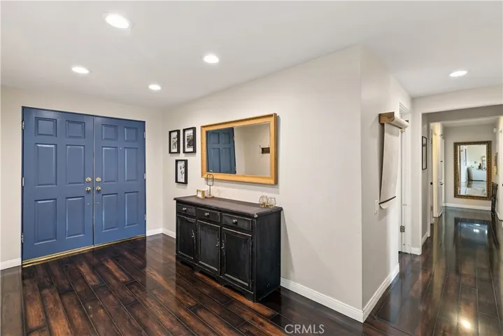 Formal entry way, double doors with new storm doors