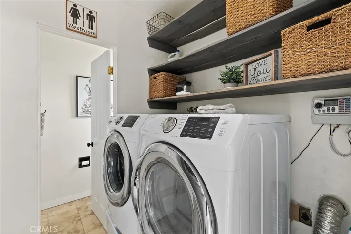 Separate laundry and 1/2 bath.  Door leading to pool area