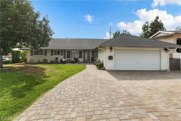 Front of house with newly extended driveway, walkway and front porch