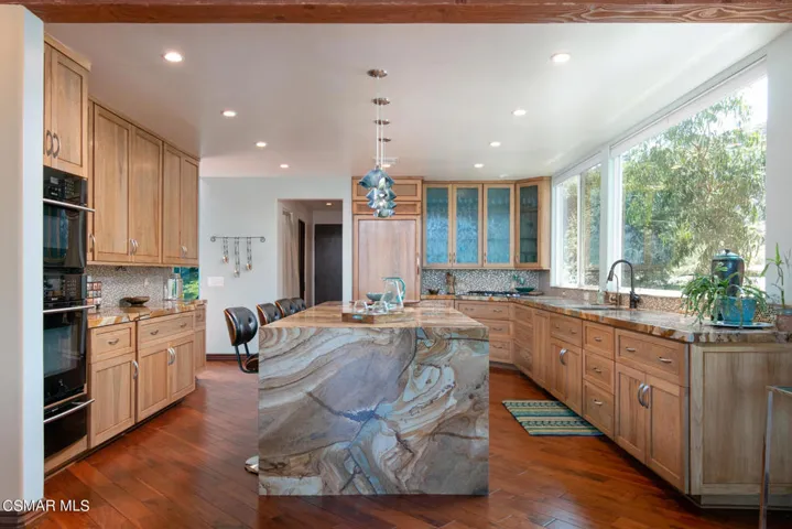 Voluminous Kitchen w Waterfall Island