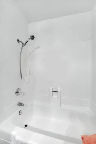 Hallway bathroom tub/shower combo.