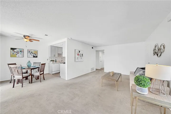 Living room opens into the dining and kitchen area.