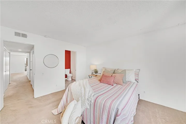 Attached bathroom with walk-in shower.