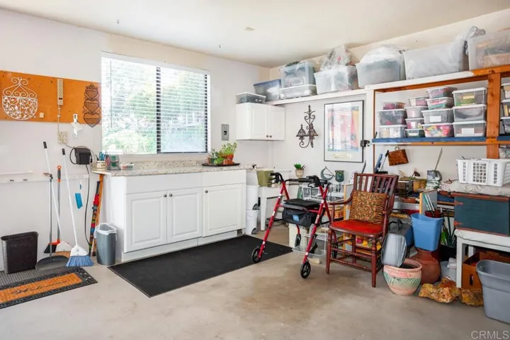 Large two car garage includes counter space and cabinets for potting your garden or more tools or ?