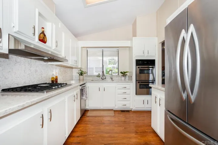 Features include upgraded counter tops and Stainless Steel appliances. Generous cabinet space!