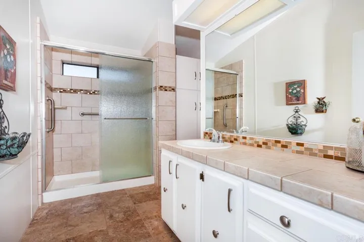 Upgraded master bath includes beautiful tile, newer vanity and linen closet for lots of storage!