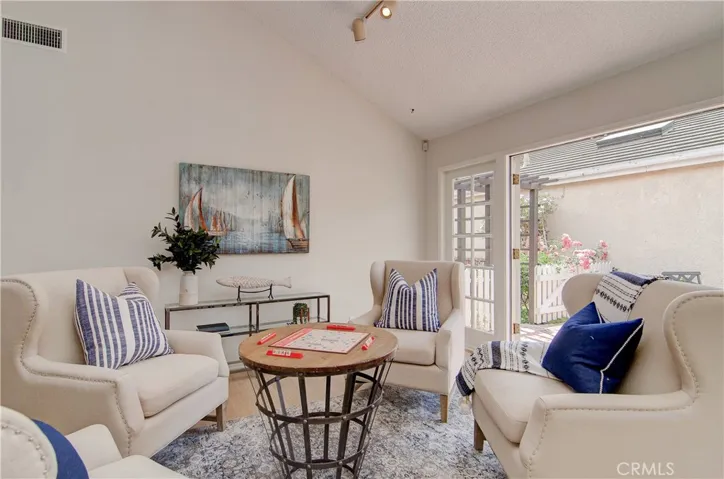 Let the games begin!...or you can just solve all of the worlds problems right here...love those French doors that bring the outside in...this is So Cal SPOILED for sure!
