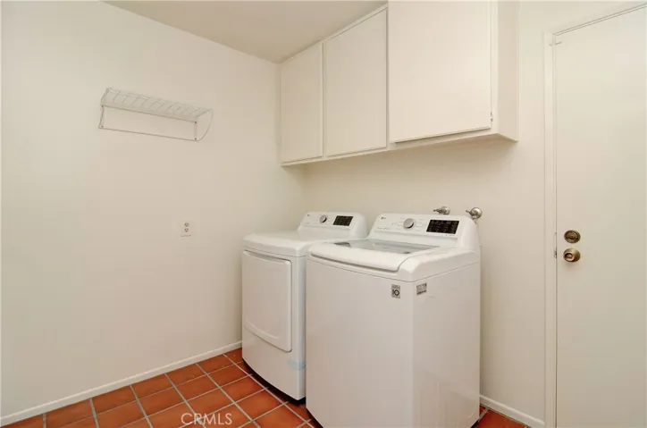 This is an awesome laundry room...plenty of space and storage...plus convenient access to oversize garage.