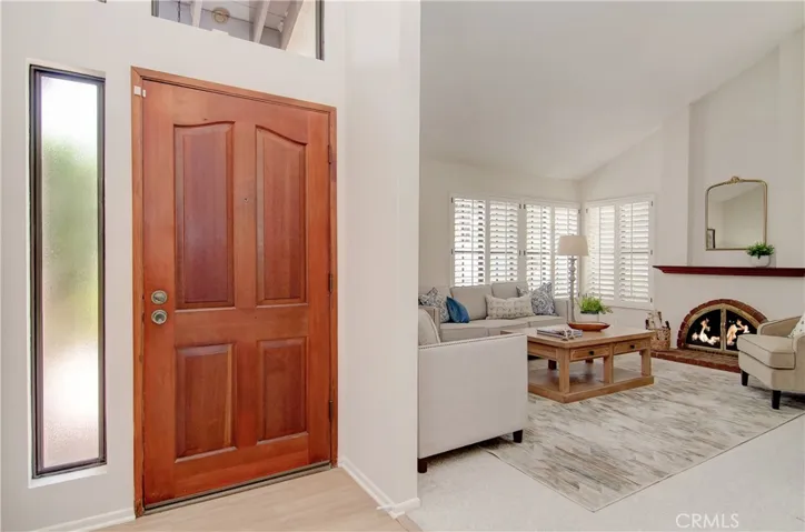 Separate entry foyer has high ceiling and clerestory window.