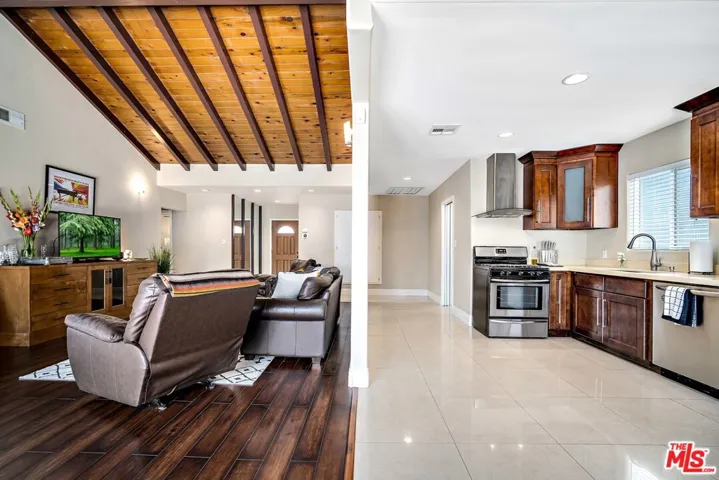 open floor plan from back door showing kitchen and living
