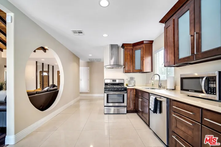 architectural opening between kitchen and living
