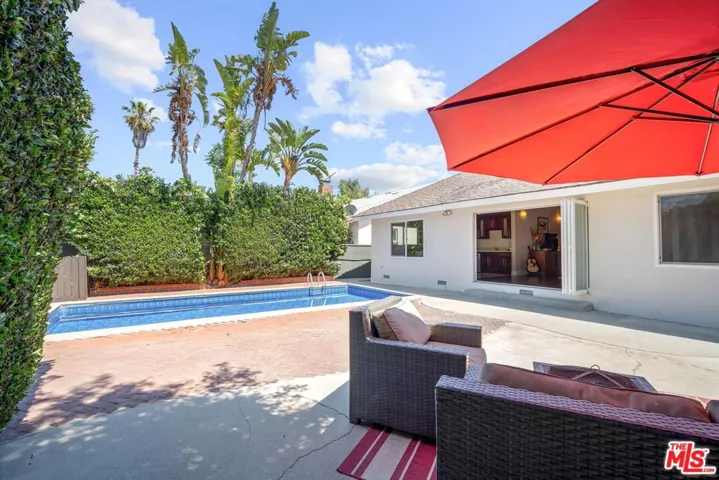 Large space around e pool and view e great walk out from your home