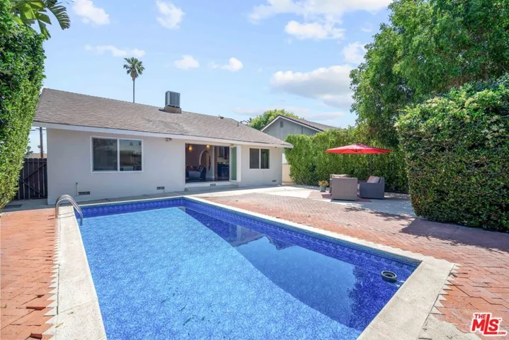sunlight and greenery surround e pool