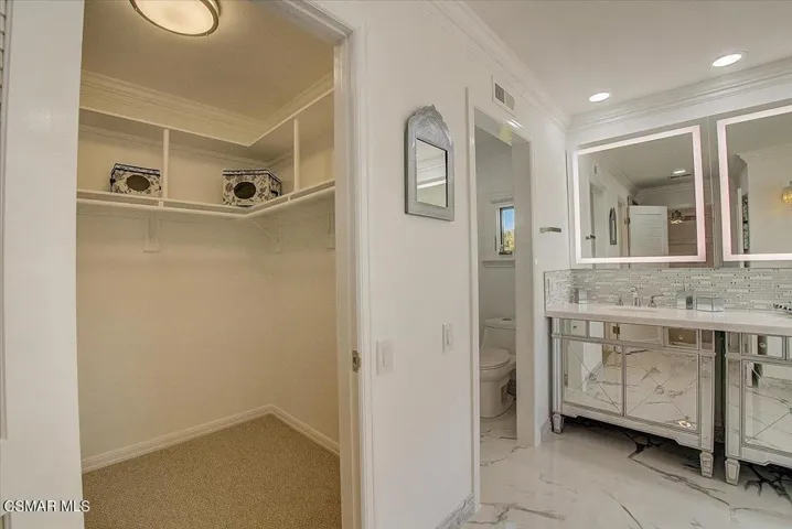 Walk-in Closet Next to Bathroom