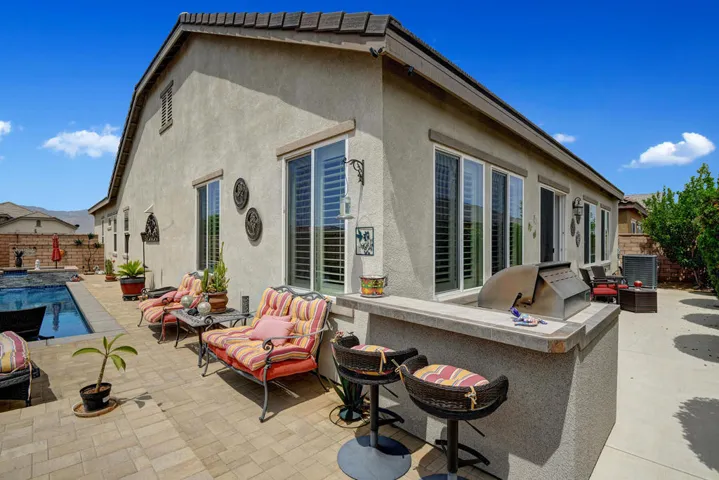 BUILT IN BBQ TO HOUSE MLS