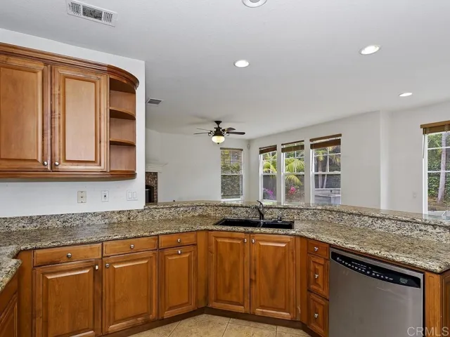 Kitchen opens to family room and informal eating area. Access to small downstairs bedroom/full bath.