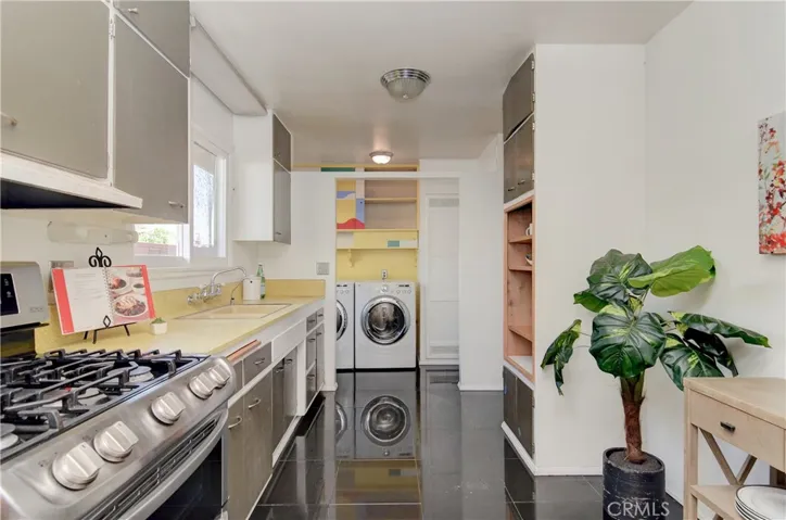 Galley kitchen offers loads of prep and storage space...even has room for your favorite kitchen hutch...adjoing utility area offers additional storage and outside entrance.