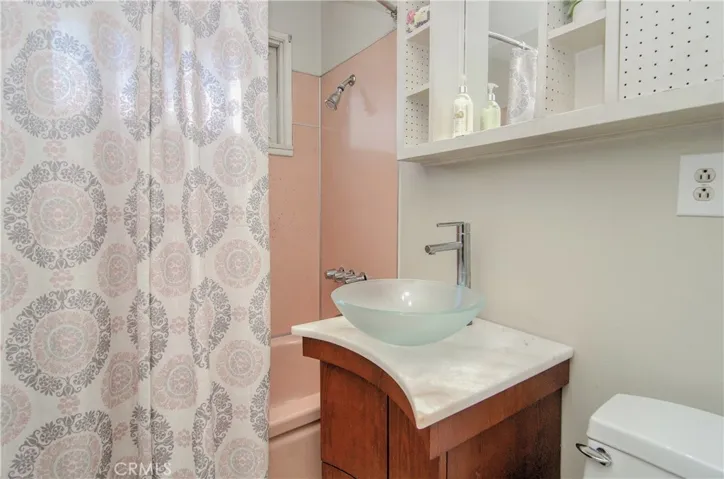 Hall bath is convenient to to all three guest/kids rooms...custom vanity with vessel sink too.