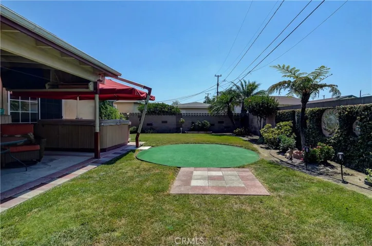 Huge rear yard offers so many options for kids, pets, gardening and more...even work on your golf skills...