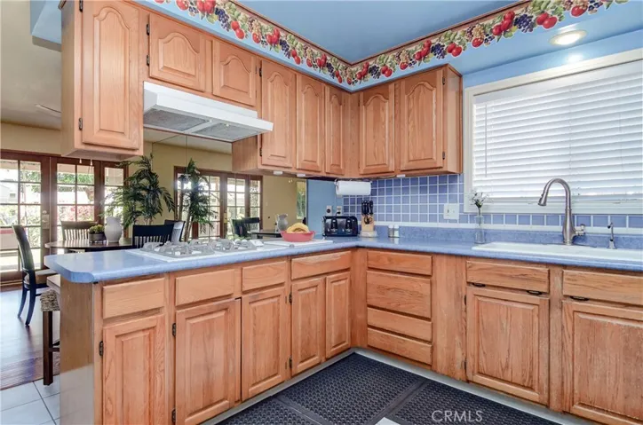 Storage, storage, storage!  Lots of rich wood cabinetry and prep space.
