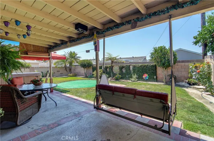 This the life...covered patio is the spot to be whether hanging out with friends or family or just a private, quiet oasis for yourself...curl up in the swing with a good book...sounds perfect!