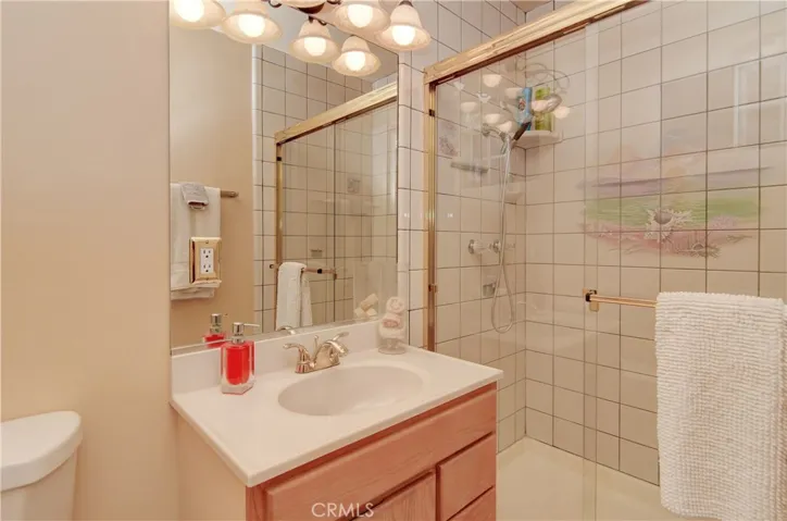 Gleaming master bath has huge tile shower.