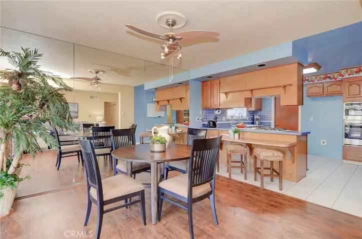 FLEXIBLE dining space allows for cozy family meals or can accommodate everyone for those holiday feasts...convenient breakfast bar is the perfect spot for homework or chatting with the chef...