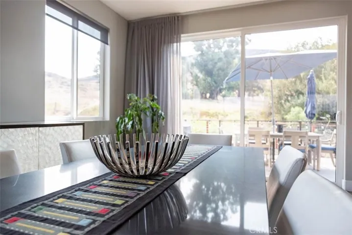 Dining area opens to back deck