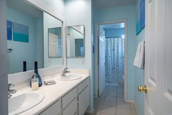 Spacious main bathroom has dual vanities and tub/shower and toilet have a their own door for privacy
