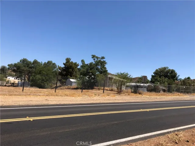 PAVED ROAD IN FRONT OF THE SUBJECT PROPERTY