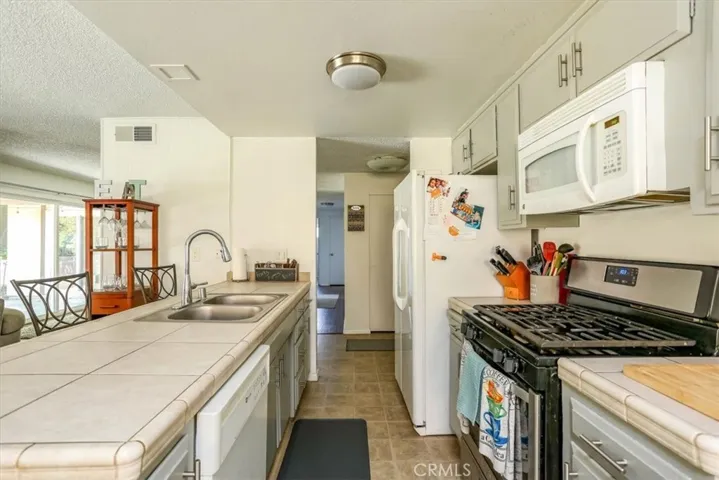 Sink/breakfast bar in this open kitchen.