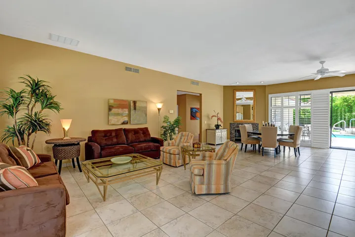 LIVING ROOM AND DINING ROOM TO POOL YARD