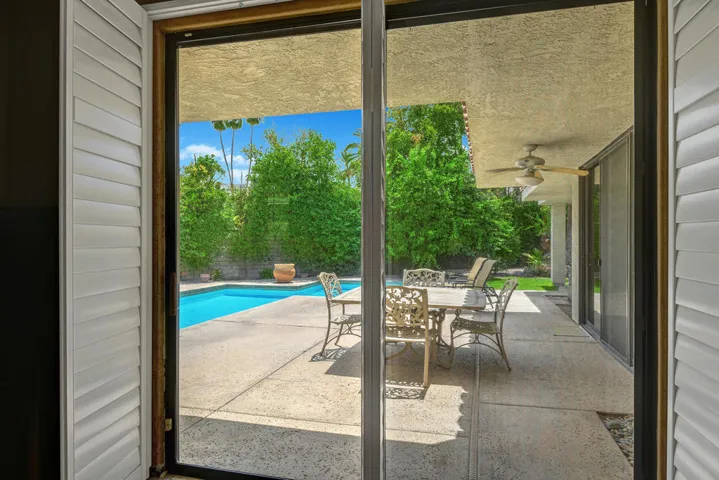 PRIMARY BEDROOM POOL YARD VIEW MLS