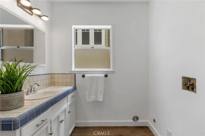 Half bath and laundry area is adjacent to the kitchen