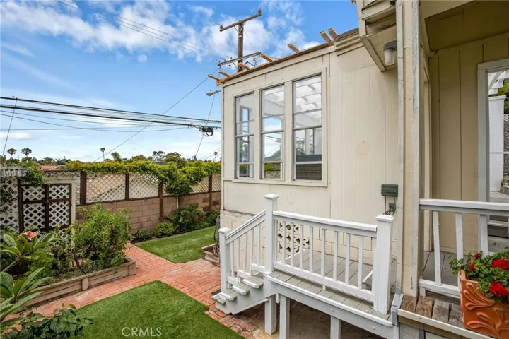 2nd level of the backyard offers gardening and play space