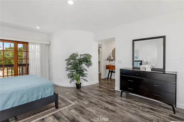 Full size primary bedroom with sitting area, walk-in closet and huge bath